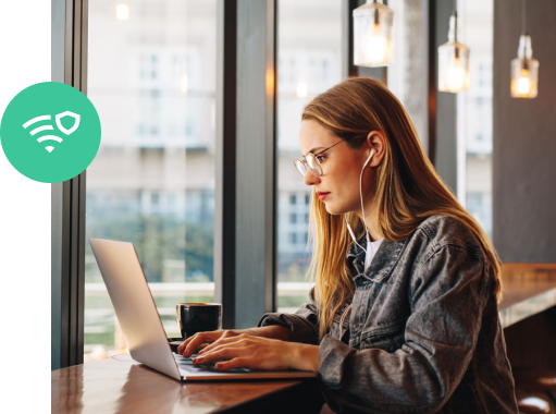 Woman in a coffee shop using a VPN