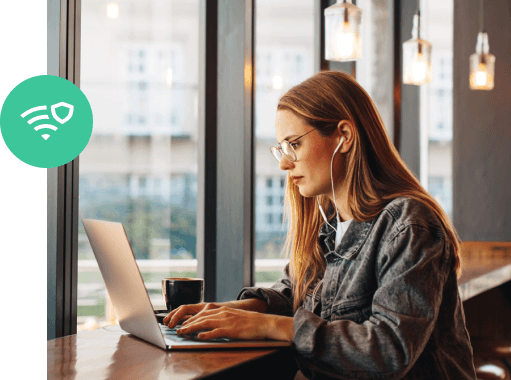 Woman in a coffee shop using a VPN